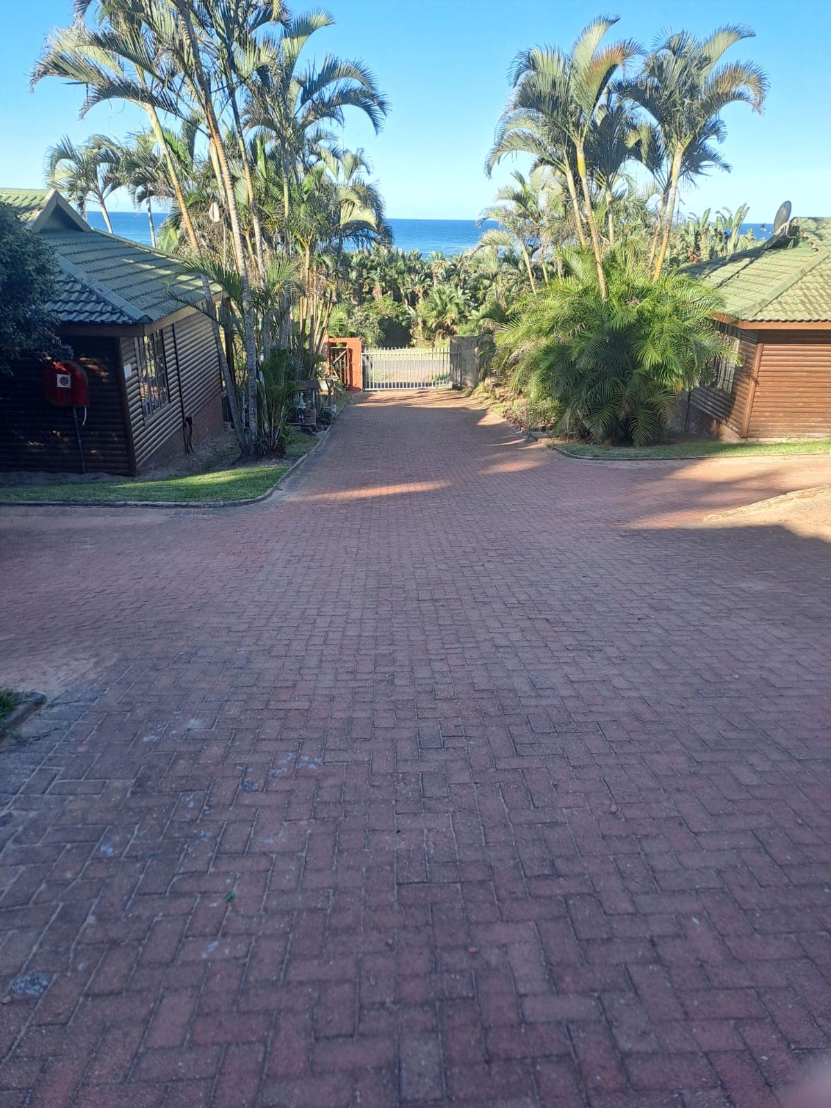 Paved lane between the villas leading to the beach gate